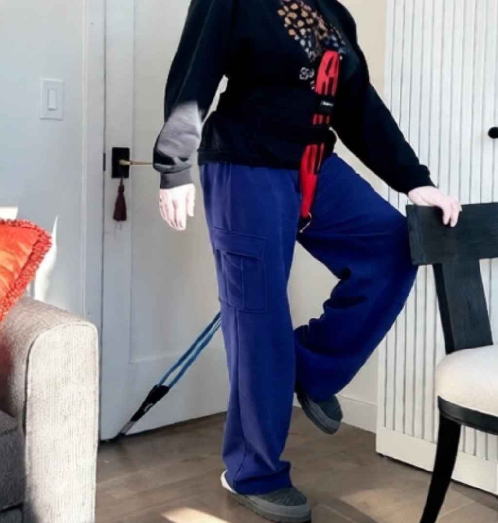 Person performing balance exercises at home