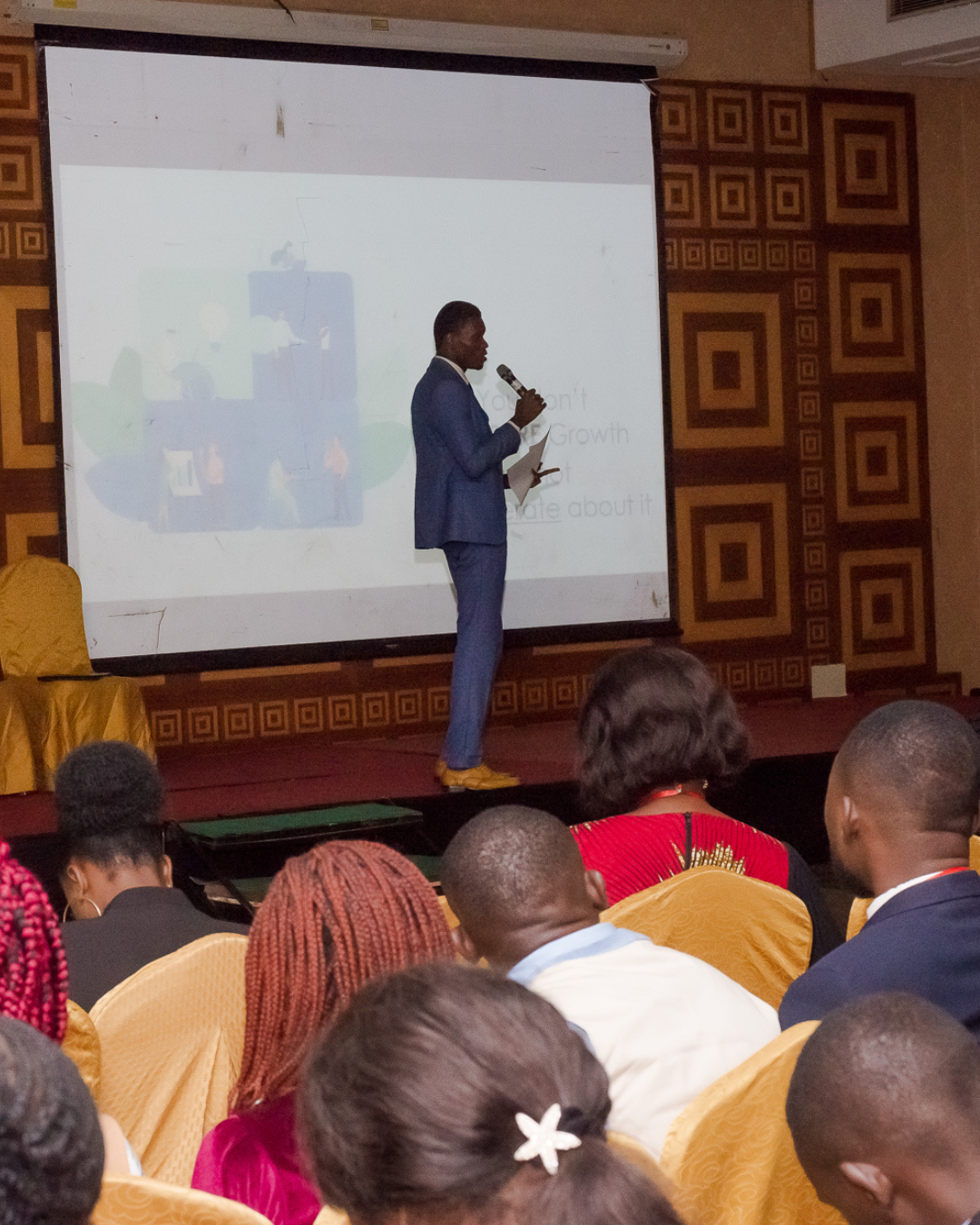Godson speaking at a business conference